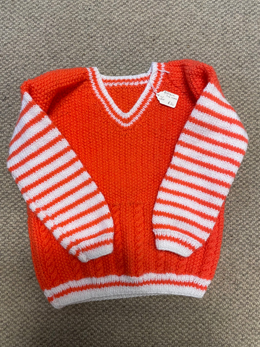 Orange coloured children’s jumper 3-4 years