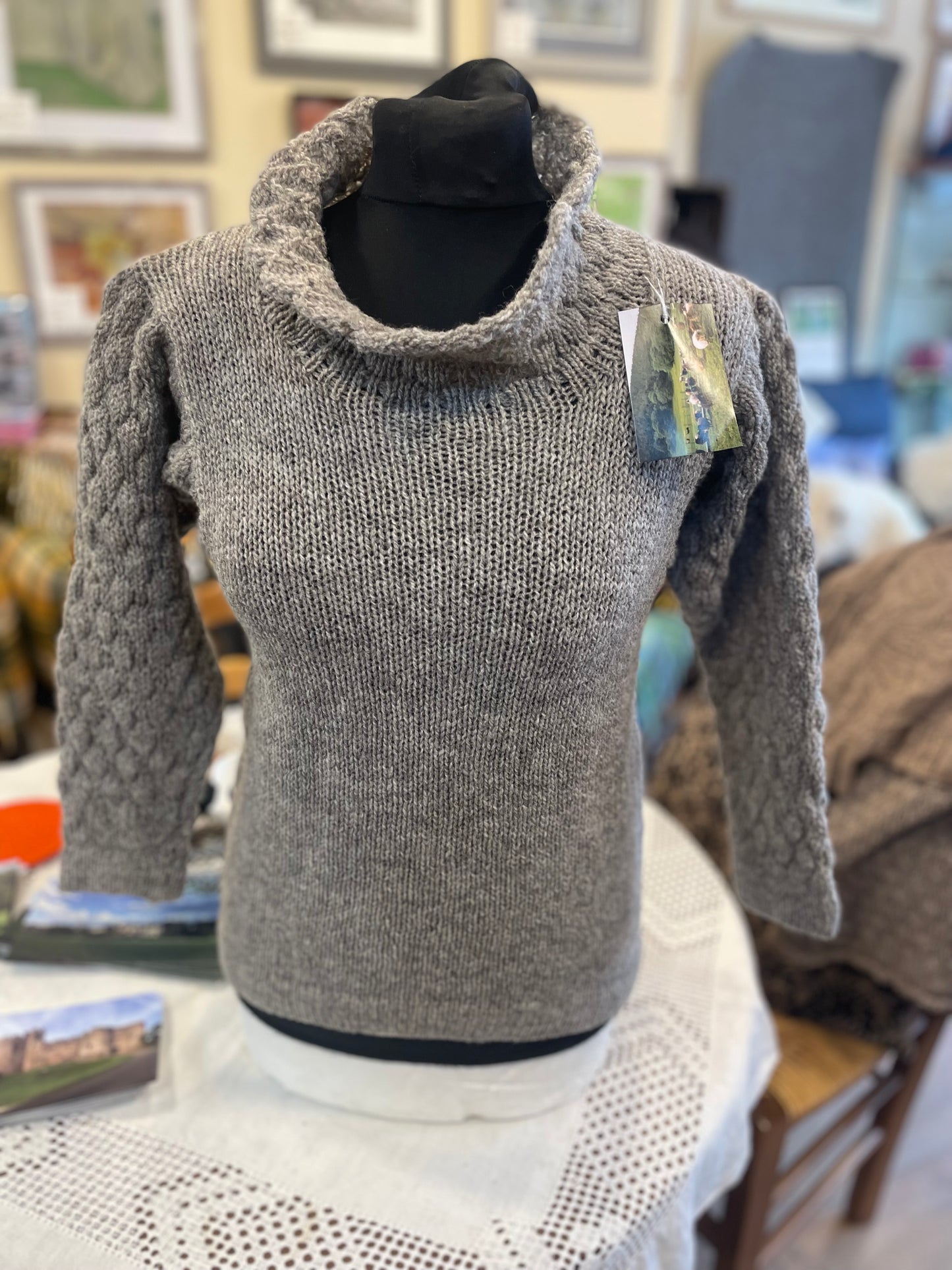 Grey natural coloured woollen jersey with wide polar neck collar